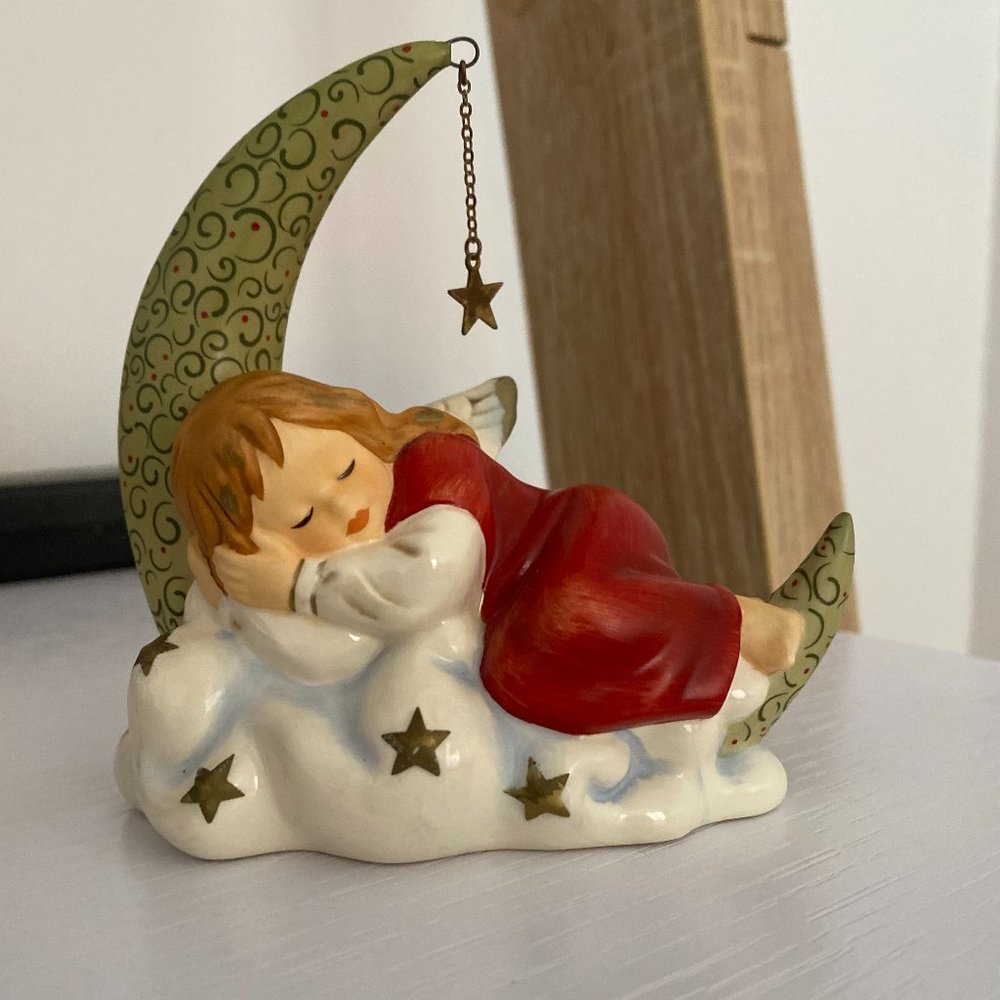Figurine of a girl dreaming